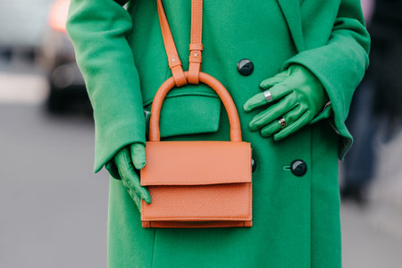 Milan, Italy - February, 27, 2022: woman wears leather shopping bag, street style detailsのeditorial素材
