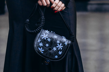 Milan, Italy - February, 26, 2022: woman wears Philosophy di Lorenzo Serafini moon bag, street style detailsのeditorial素材