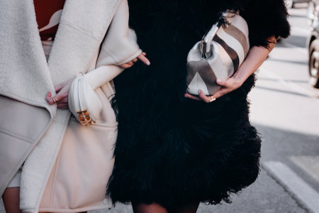 Milan, Italy - February, 27, 2022: woman wears leather Fendi stripe suede First Small bag, street style detailsのeditorial素材