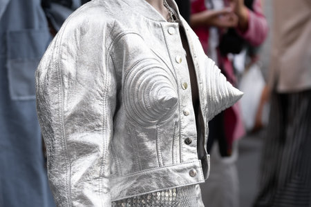 Milan, Italy - September, 21, 2022: woman wearing silver cropped jacket and matching embroidered rhinestones skirt, street style outfit detailsのeditorial素材