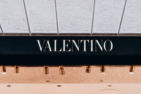 Milan, Italy - November, 13, 2021: Facade logo of fashion womens clothing store Maison Valentino. Luxury storeのeditorial素材