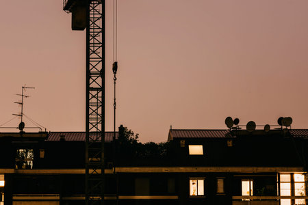 Crane and lightning, powerful thunderbolt. Weather risk assessments for the construction industry...