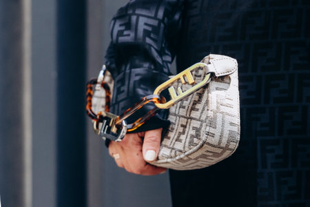 Milan, Italy - June, 18, 2022: woman wears beige Olock Swing Logo-jacquard Chenille Shoulder bag, street style accessorieのeditorial素材