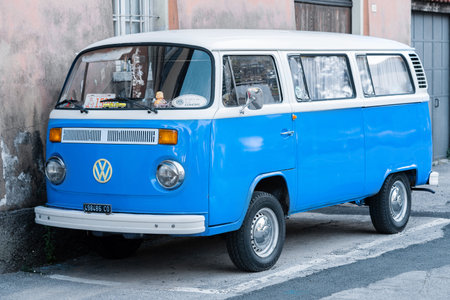 Milan, Italy - September 1, 2022: Minibus with parked near house. Scale model Volkswagen Transporter...