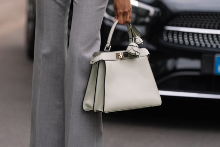 Milan, Italy - February 22, 2023: woman wearing Fendi Peekaboo shoulder bag. Fashion blogger outfit...