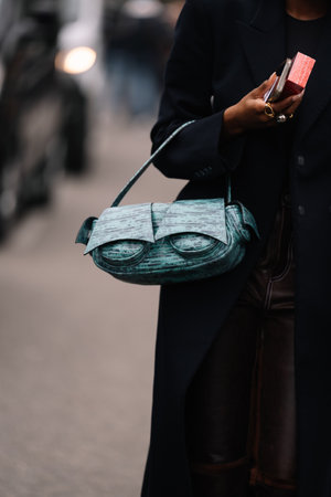 Milan, Italy - February 22, 2023: fashioner wearing 16 Arlington shoulder bag. Fashion blogger outfit details, street styleのeditorial素材