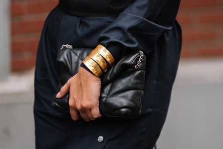 Milan, Italy - September 20, 2023: fashioner wearing Maison Margiela shoulder bag. Fashion blogger outfit details, street styleのeditorial素材