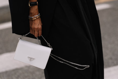 Milan, Italy - September 21, 2023: fashioner wearing Prada shoulder bag. Fashion blogger outfit details, street styleのeditorial素材