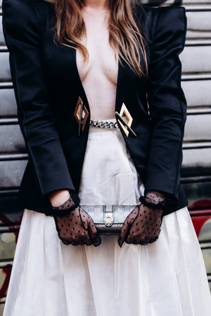 Milan, Italy - June 25, 2022: fashioner wearing Gucci wallet purse bag. Fashion blogger outfit details, street styleのeditorial素材
