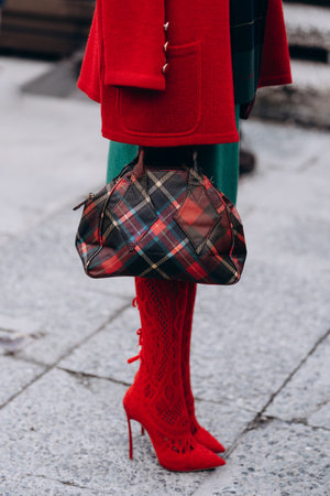 Florence, Italy - January 12, 2023: fashioner wearing Vivienne Westwood shoulder bag. Fashion blogger outfit details, street styleのeditorial素材