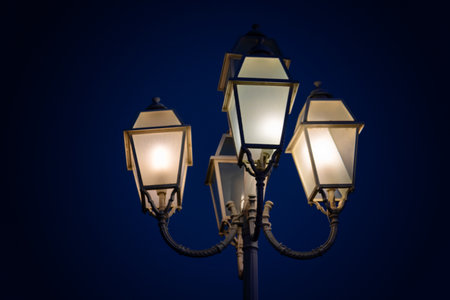 Vintage street light against the evening blue sky, city lanternの写真素材