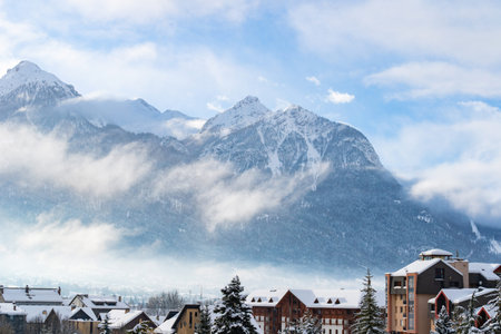 Cityscape of Brianson, ski resort in France. Mountain covered with snow and fog. Alpine landscape in Europe.の写真素材