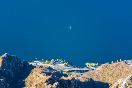 Mountain landscape, picturesque mountain lake in the summer morning, large panorama, landscape with fabulous lake view from the top of the mountain, with view of city.の写真素材