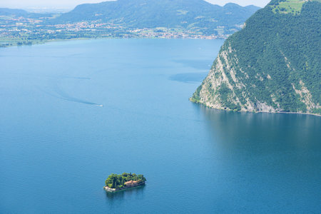 Mountain landscape, picturesque mountain lake in the summer morning, large panorama, landscape with fabulous lake view from the top of the mountain, with view of city. Iseo, Italyの写真素材