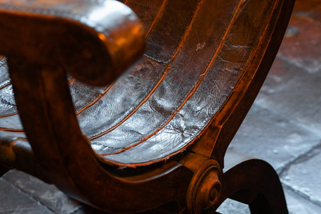 Gradara, Italy - August, 25, 2022: close up of worn leather chair with detailed texture in Gradara Castle, Italyのeditorial素材