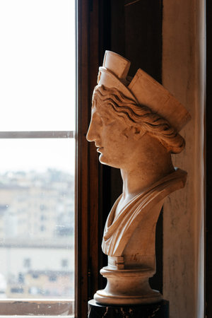 Florence, Italy - September 01, 2022: elegant marble bust of classical figure, captured in profile...