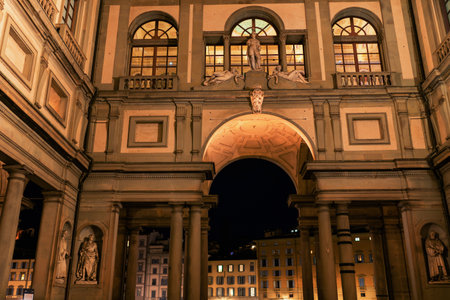 Florence, Italy - August, 31, 2022: statues and archway lit beautifully at night in florences historic squareのeditorial素材