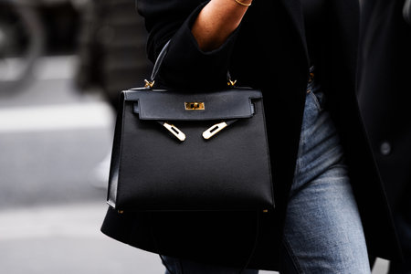 Paris, France - February, 29, 2024: woman wears Hermes Kelly bag, fashion blogger outfit details, street style.のeditorial素材