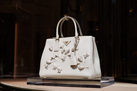 Milan, Italy - 24.04.2024: Prada bag at the showcase of the store at shopping gallery in the center...