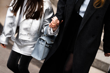Paris, France - February, 29, 2024: woman wears Hermes Kelly bag, fashion blogger outfit details,...