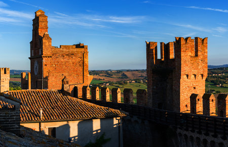 Gradara, Italy - August, 25, 2022: view of gradara castle walls and tower with surrounding countryside under blue skyのeditorial素材