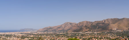 Panoramic view of Palermo city and mountains from Monreale town, Sicily, Italy, vast coastal cityscape framed by mountains in background, coastline and urban landscapeの写真素材
