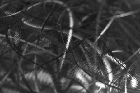 Abstract metallic texture with grunge pattern in black and white for artistic background design.