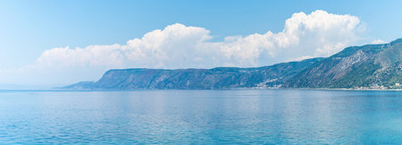 View of coastline in southern Italy. Scenic view from on top cliff looking out to sea on sunny summer day. Calabria coastlineの写真素材
