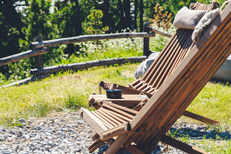 Two wooden chairs with mountain view at mountain resort. Vacation, travel and trip concept.の写真素材
