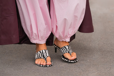 Paris, France - October, 6, 2025: Woman wears Zara zebra print heeled sandals. Fashion outfit shoes detail, street style look accessoryのeditorial素材