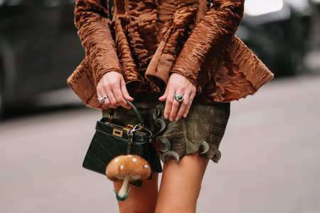 Milan, Italy - September, 24, 2025: woman wears white Fendi ISeeU Petite bag. Fashion outfit handbag details, street style look accessoryのeditorial素材