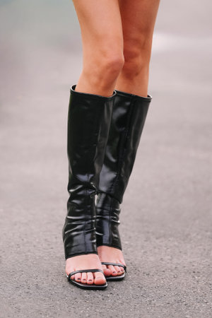 Milan, Italy - February, 24, 2026: woman wears Bershka shoes. Fashion outfit details, street style...