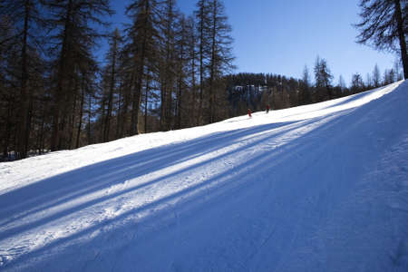 Ski downhill course and a big mountains in Puy St. Vincent (France)の写真素材