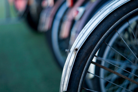 Bicycle Wheel with Green Backgroundの写真素材