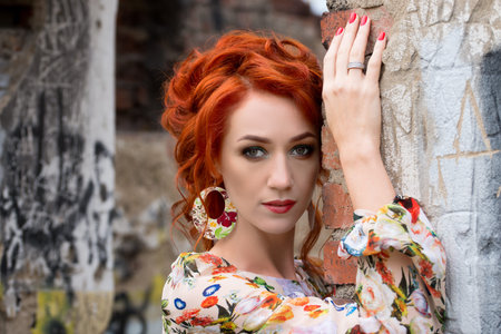 beautiful readhead woman in the autumn forest