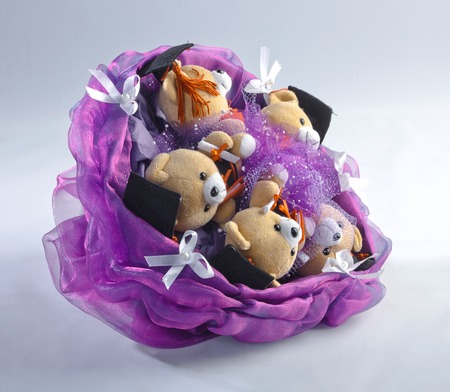 Bouquet of beautiful toys on a colored backgroundの写真素材