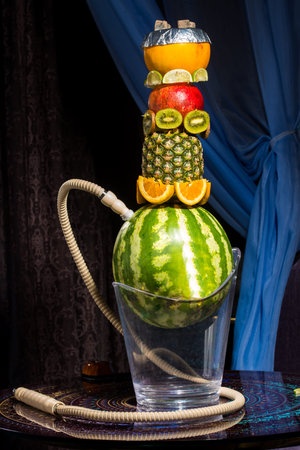 Exotic hookah with fruits over blue backgroundの写真素材