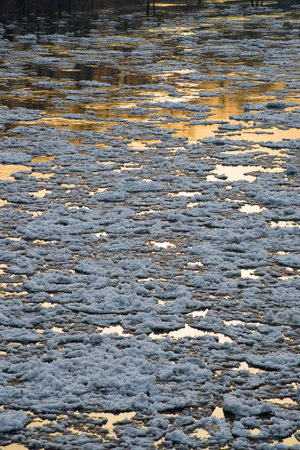 Ice drifting on the river at sunset