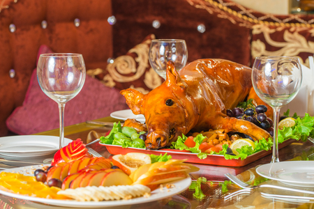 Roasted pig on rich table in eastern restaurantの写真素材