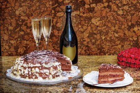 Chocolate cake with champagne on the tableの写真素材