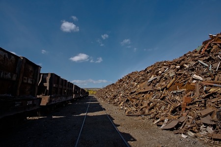 Pile of rusty scrap metal and wagonの写真素材