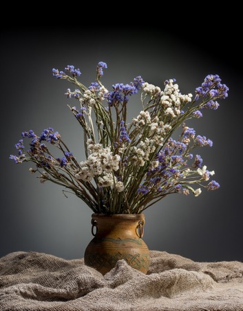 isolated bouquet of flowers in old vaseの写真素材
