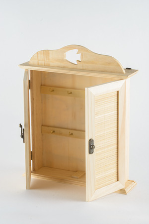 Doll wooden furniture wardrobe on a monophonic backgroundの写真素材