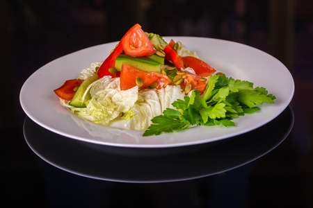Fresh Vegetable salad with Parsley on plateの写真素材