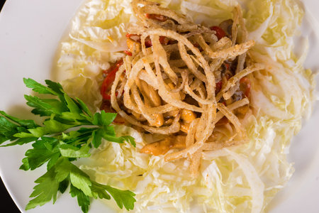 Chinese cabbage and onion salad with potato close up