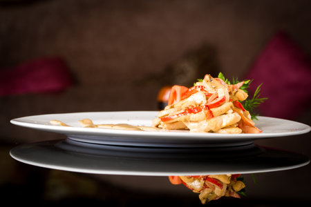 Vegetable salad with sauce on black background