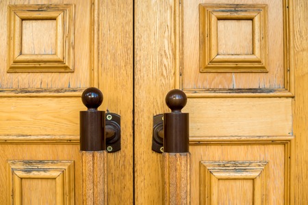 two wooden door metal handlesの写真素材