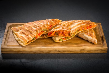 Samosa triangles stuffed with vegetables on the boardの写真素材