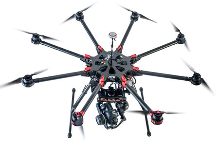 octocopter drone with digital camera in flight on white background