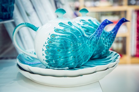 two beautiful antique teapots in blue colorの写真素材
